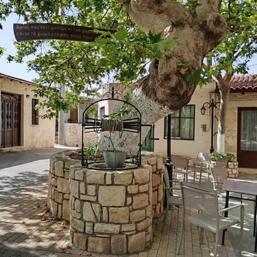 Alagni Village square with a Platanus tree, an old well, and a drinking water spring