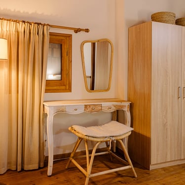 Bedroom at Tonia's Cottage with a wardrobe, window, and nightstand