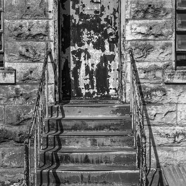 Gritty steps and side door of historic old Williamson County Jail in Texas