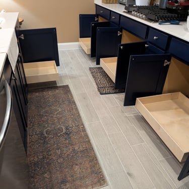 Several base cabinet glide-out shelves installed to increase accessibility.