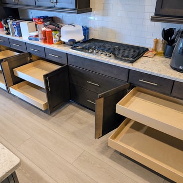 Large pull-outs provide significantly more storage in this kitchen.