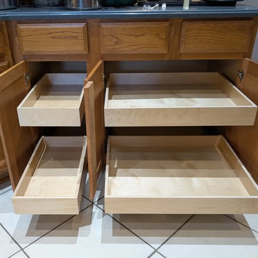 Pull out shelf installation in two kitchen cabinets. 