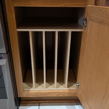Tray divider installed in a base cabinet.