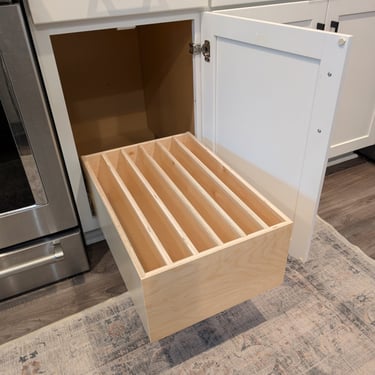 A Shelf Hero slide-out with dividers for organizing trays, cookie sheets  and platters.