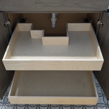 Under-sink cabinet pull-outs that are built to fit around plumbing obstacles.