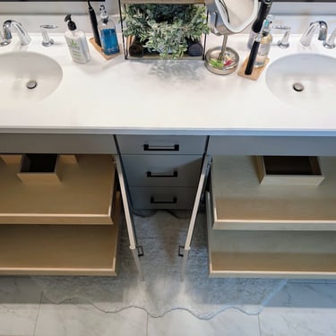 Slide-out storage under vanity sinks by Shelf Hero.