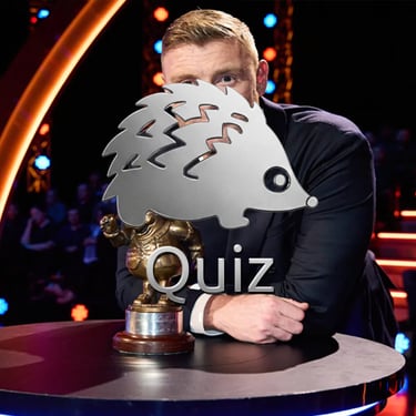 a man in a suit and tie is holding a trophy