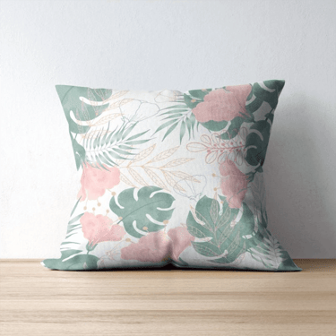 a decorative pillow with a tropical print