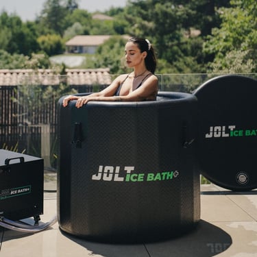 a woman in a tub tub with a large ice bathtub