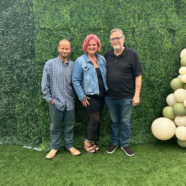 3 people standing next to each other