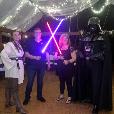 couple with light sabers