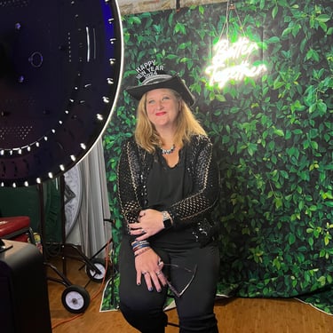 women posing for photo booth