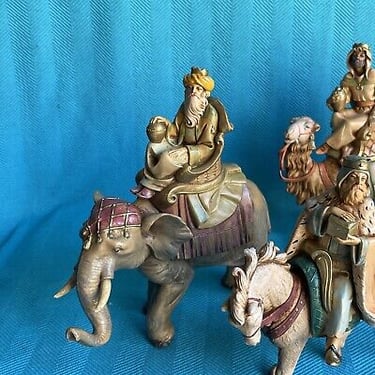Wise Men riding an elephant, a camel, and a horse