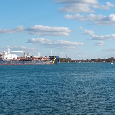 Great Lakes tugboat Albert meets tanker ship Mia Desgagnes on the St. Clair River in East China, Michigan. 
