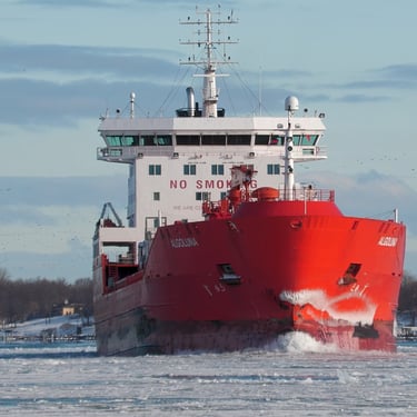 Ice on the bow of tanker ship Algoluna as she heads toward the camera in icy water.