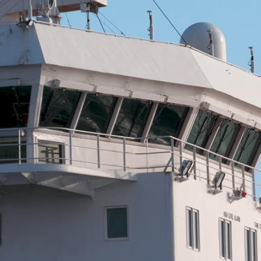 The front and starboard side bridge windows of tanker ship Algoluna.