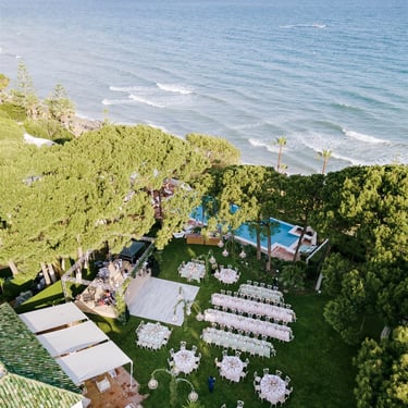 Aerial view of beachfront wedding reception in Marbella