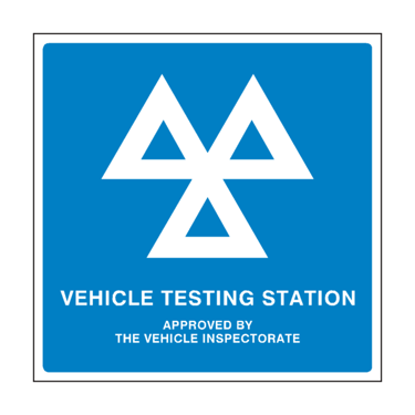 a vehicle testing station with a blue and white sign that says vehicle testing