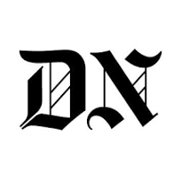 a black and white photo of a letter dn