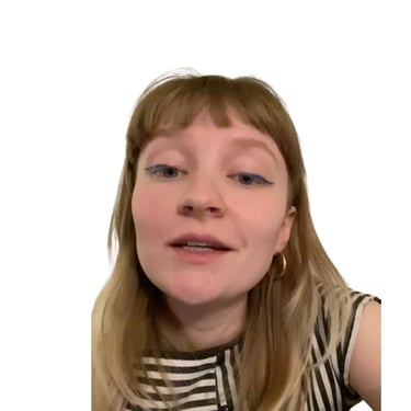 a woman looking into the camera as if saying something