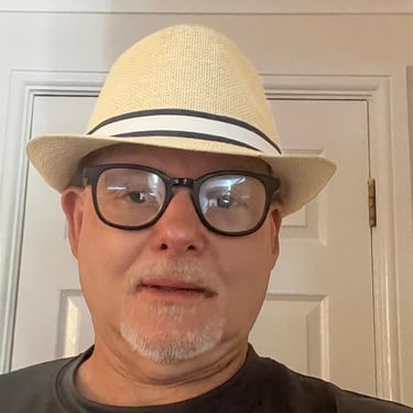 daz hull wearing a hat and glasses on a white background