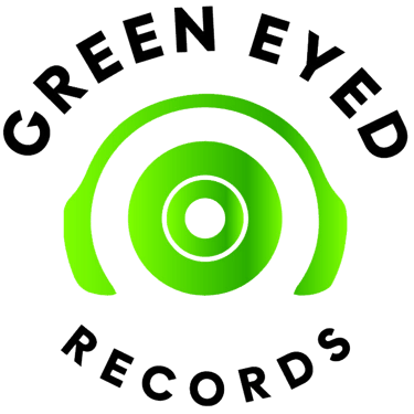 a green eyed record player's headphones and headphones