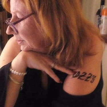 a woman with a tattoo on her arm