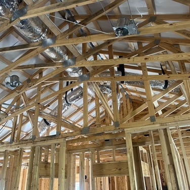 Exposed rafters and newly installed ductwork in a new construction home in Carthage, TN by Hoot Heating & Cooling
