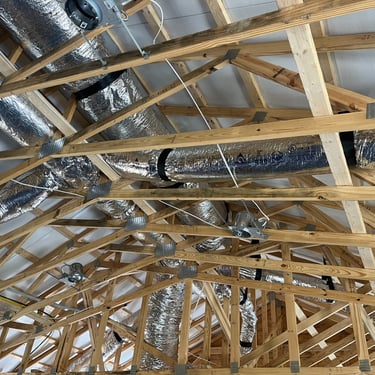 HVAC ductwork running through ceiling joists during new construction home framing in Carthage, TN
