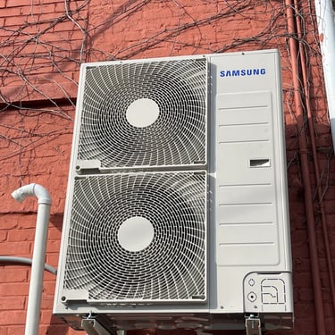 HVAC system mounted outside of a small commercial HVAC job.