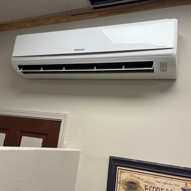 Mini split installed on a wall to provide heating and cooling