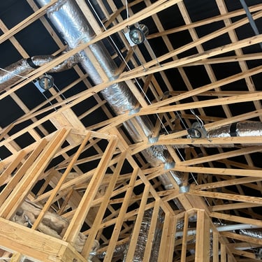 Ductwork running through the ceiling of a new construction home HVAC installation.