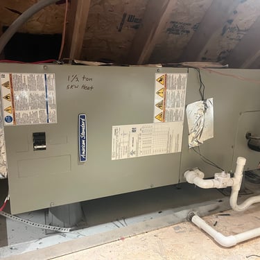 Professional HVAC installation of air handler with insulated ductwork for reliable home heating and cooling performance.
