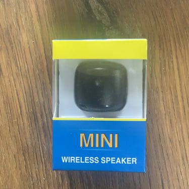 a mini wireless speaker with a mini wireless speaker