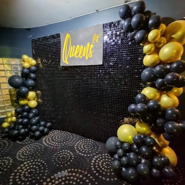 Black shimmer wall with balloon garland for the happening night club in Brisbane.