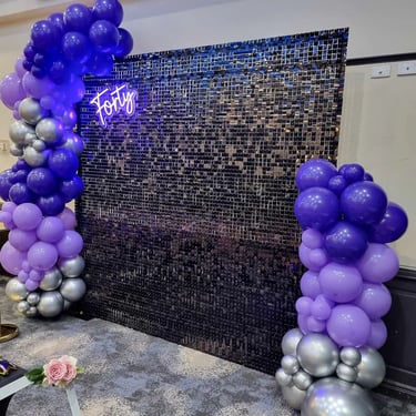 Black shimmer wall and 3m balloon garland for the pimped photo booth in Logan.