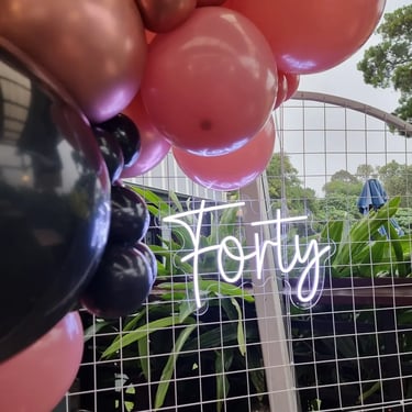 Forty neon sign on a circle backdrop for Violet's 40th birthday in Redland Bay.