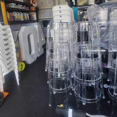 Ghost Stools in the garage to be loaded for an 18th Birthday in Cornubia, Logan - party hire by SweetAz Co.