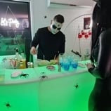 Bartender preparing drinks at the glow bar decorated for halloween event in Brisbane.