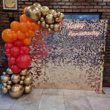 Rose gold shimmer photo wall for hire in Brisbane for anniversary party at an Indian restaurant.