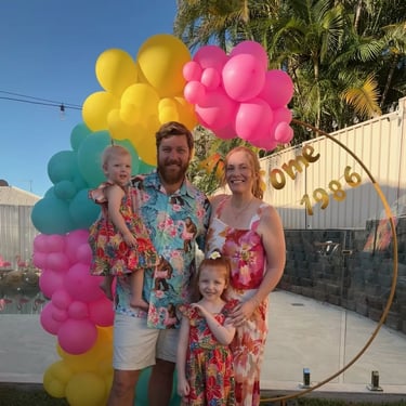 Gold Hoop backdrop with the family posting at a 40th Party in Redlandbay, Redlands - party hire by SweetAz Co.