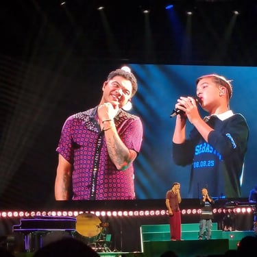Guy Sebastian singing live with his son at the Entertainment Centre in Boondall, Brisbane - party hire by SweetAz Co.