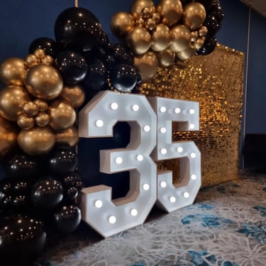 Lightup Number in front of the gold shimmer wall at a 35th Celebration in Manly, Brisbane - party hire by SweetAz Co.