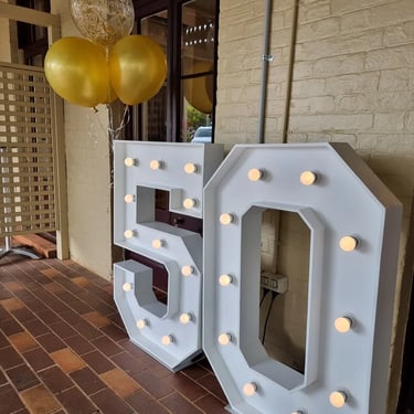 Marquee Number 50 standing tall at a 50th Wedding in Cleveland, Redlands - party hire by SweetAz Co.