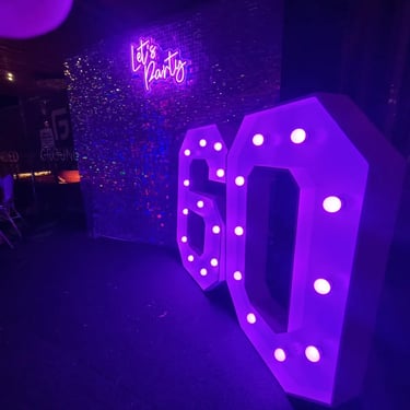 Marquee Number glowing pink for a 60th Celebration in Currumbin, Gold Coast - party hire by SweetAz Co.