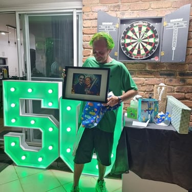 Marquee Number behind the birthday boy at a Fiftieth Party in Tanahmerah, Logan - party hire by SweetAz Co.