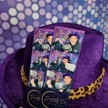 Flat lay of SweetAz Co photo booth print strips featuring custom event templates and high quality finishes.