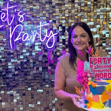 Shimmer Wall behind birthday girl and cake at a Birthday Celebration in Cleveland, Redlands - party hire by SweetAz Co.
