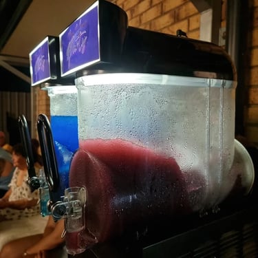 Slushie Machineadding the cool at a 60th Birthday in Wynnum, Brisbane - party hire by SweetAz Co.