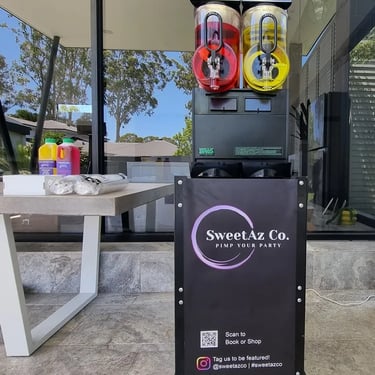 Slushie Machine cooling down beside the glow bar at a Christmas Party in Ormiston, Redlands - party hire by SweetAz Co.